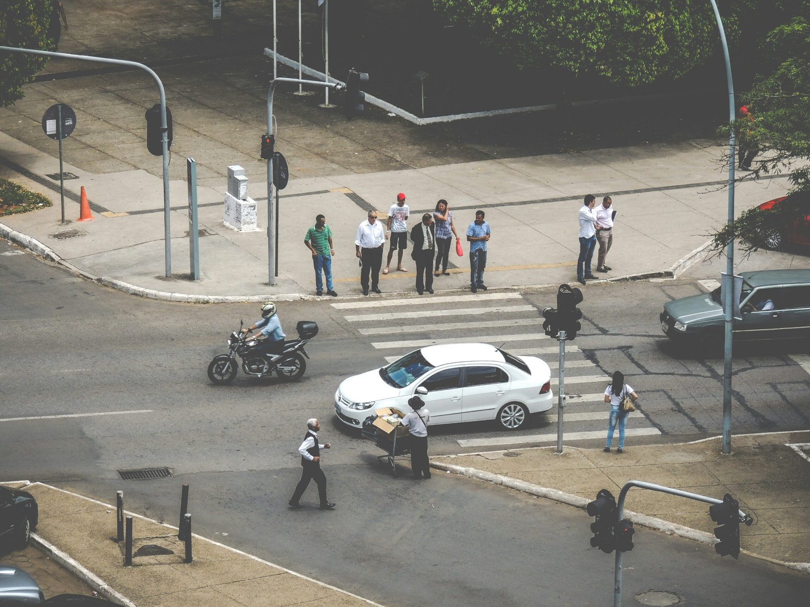 white car on ped xing